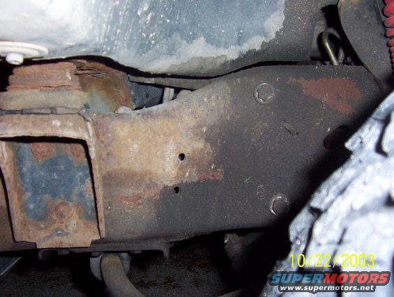 100_0347.jpg front part of frame behind bumper on left side