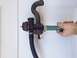 1994 Ford Bronco - A diverter valve assembly with hoses is shown, with a hand gripping one of the hoses.