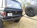 1967 Ford Mustang - Rear view of a black Ford Bronco, a spare tire mounted externally and a Mississippi license plate.