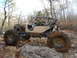 1967 Ford Mustang - A custom-built buggy navigates a rocky trail with two occupants.