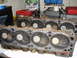 1995 Ford Bronco - Engine cylinder heads are shown, with multiple valves visible in each cylinder bore.