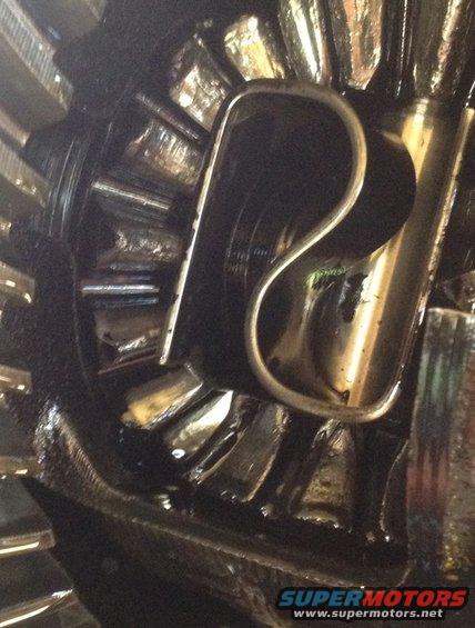 Close-up of damaged differential gears with a bent metal piece