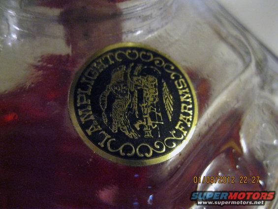 Gold and black circular label reading 'AMPLIGHT FARMS' with a graphic in the center. Date stamp '01/08/2012 22:27' and 'SUPERMOTORS' logo visible