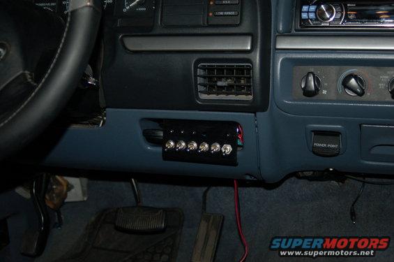 Dashboard with a custom switch panel installed below the air vents. Includes a power point outlet