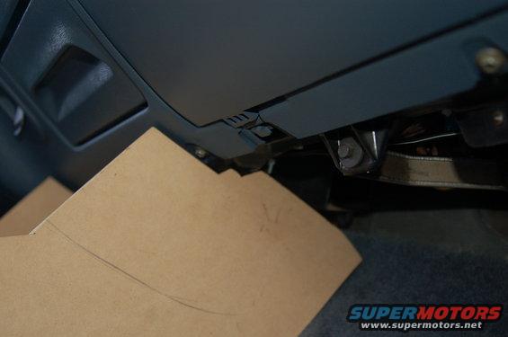 Cardboard template placed under dashboard, near a vent
