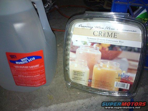 Jug of white muriatic acid next to a container of Creme brand wax