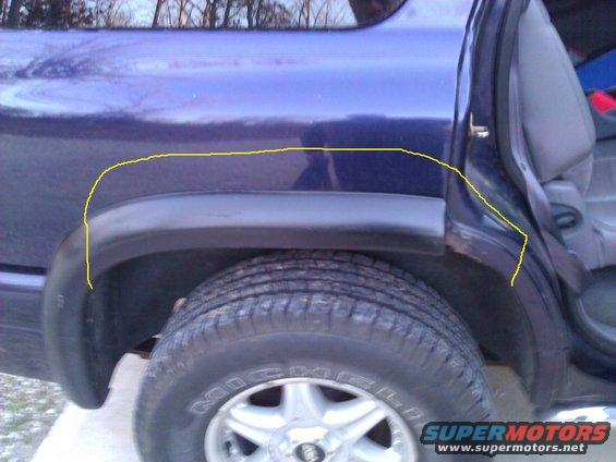 Purple SUV rear wheel well and open rear door, showing interior gray seat and black trim. Yellow line highlights body damage