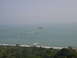 1993 Ford Bronco - A wide view of the ocean with several small islands and a coastline with trees.