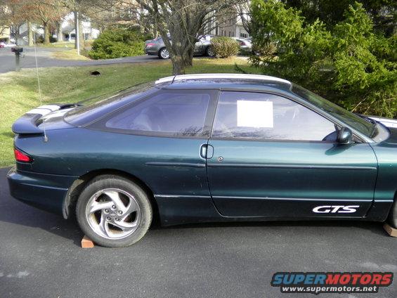 Dark green 1997 Ford Probe GTS side view