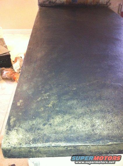 Dark textured surface with gold flecks