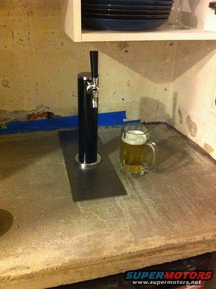 Beer tap and mug on a concrete counter