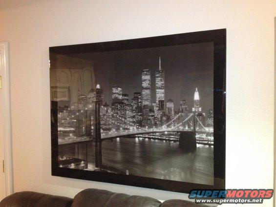 Black and white photo of the New York City skyline at night, the World Trade Center and Brooklyn Bridge