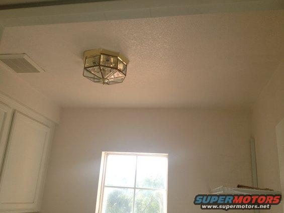 ceiling light fixture with glass panels, vent, and window