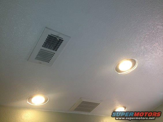 Ceiling with air vents and recessed lighting