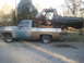 1978 Ford Bronco - A pickup truck carries a disassembled Bronco body, suggesting a project or parts transfer.