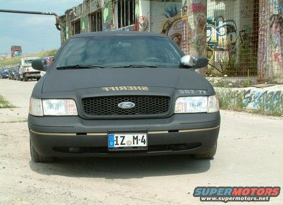 Front view of matte black 2003 Ford Crown Victoria with "SHERIFF" text