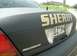 2003 Ford Crown Victoria - Rear view of a dark Sheriff's vehicle, identified as a 2003 Ford Crown Victoria Police Interceptor.
