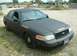 2003 Ford Crown Victoria - This Ford Crown Victoria is marked as a Sheriff's vehicle and is parked outdoors.