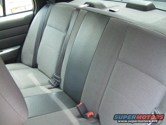Gray fabric rear seat with black vinyl accents and seat belts