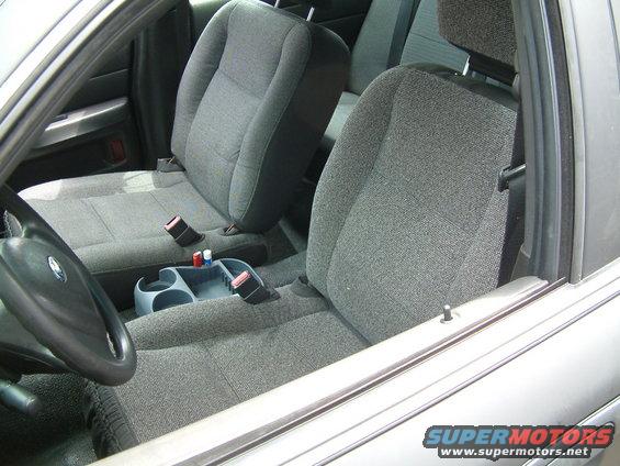 2003 Ford Crown Victoria interior showing front seats, steering wheel, and center console