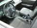 2003 Ford Crown Victoria - The interior of a 2003 Ford Crown Victoria is captured, highlighting the driver's area and passenger seating.
