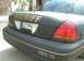 2003 Ford Crown Victoria - Rear view of a 2003 Ford Crown Victoria Police Interceptor marked with "SHERIFF" and unit number 382-77.