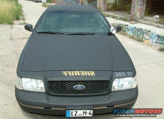 Front view of a black 2003 Ford Crown Victoria police car with "SHERIFF" text