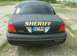 2003 Ford Crown Victoria - This vehicle is marked as 'SHERIFF' and has a German license plate, suggesting it is not a US police car.