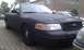 2003 Ford Crown Victoria - Matte black 2003 Ford Crown Victoria police car marked as 'SHERIFF' is parked outdoors.