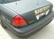 2003 Ford Crown Victoria - Rear view of a dark gray 2003 Ford Crown Victoria Police Interceptor with sheriff markings and a license plate.