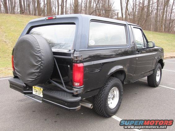 Black 1996 Ford Bronco, rear view, with spare tire mounted on the back door. New Jersey license plate YAW-26F