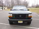 1996 Ford Bronco - Front view of a black Ford Bronco, parked in an outdoor lot.