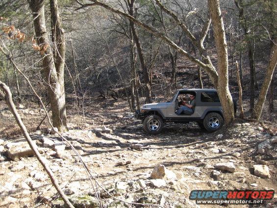 Gray 2005 Jeep Wrangler parked on rocky trail