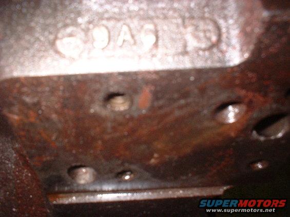 Close-up of cast numbers on an engine block, possibly '9A6'