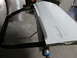 1987 Dodge 1500 - A white car door with black trim is prepped for painting.