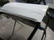1987 Dodge 1500 - A freshly painted white vehicle door rests on a stand, awaiting reinstallation.