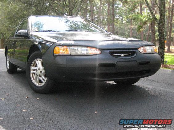 1997 Ford Thunderbird front view with car cover on hood