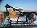 1973 Harley-Davidson Ultra - A motorcycle frame is loaded into the bed of a pickup truck, which is covered in snow.
