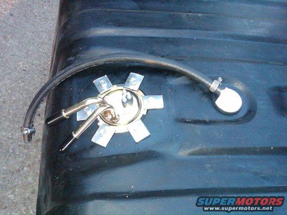 Fuel tank sending unit with fuel line attached to a black tank