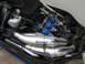 1987 Polaris Indy 600 - Close-up view of a snowmobile's engine compartment, highlighting the exhaust system and ignition components.