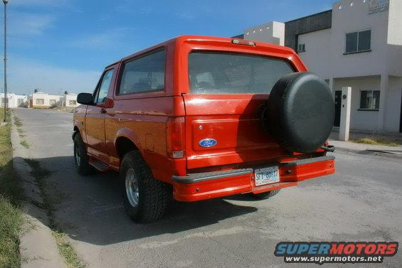 1995 Ford Bronco rear view, red paint, spare tire on back