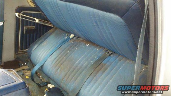 1978 Ford Bronco interior rear seats with blue upholstery and seatbelts