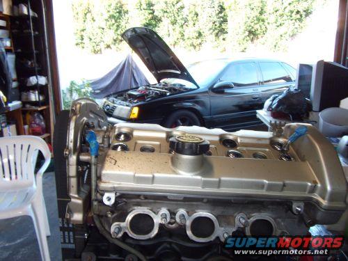1991 Ford Taurus engine and car in garage