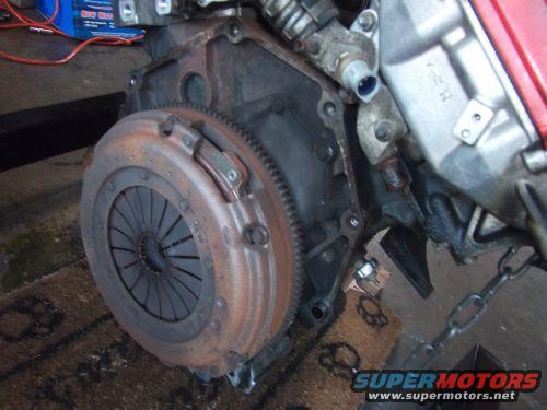 Engine and clutch assembly with rusty flywheel