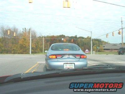 1997 Ford Taurus rear view at intersection, license plate AB 6348