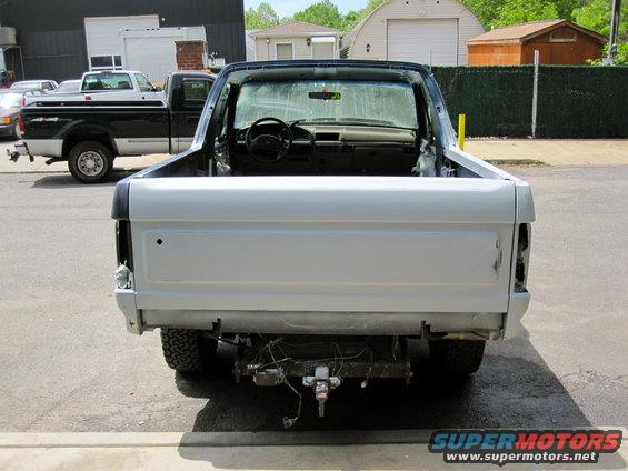 Rear view of a 1992 Ford Bronco with the top removed, light blue paint