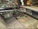 1971 Dodge Dart - The interior of a 1971 Dodge Dart shows its dashboard, steering wheel, and seats, with visible rust on the floor.