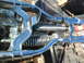 1973 Harley-Davidson Ultra - Close-up of a blue wiring harness and engine parts, likely from a motorcycle.