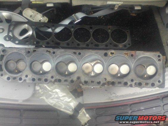 Engine cylinder heads and gasket removed from a vehicle