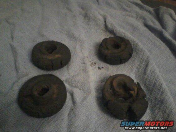 four old, worn brake rotors on a towel